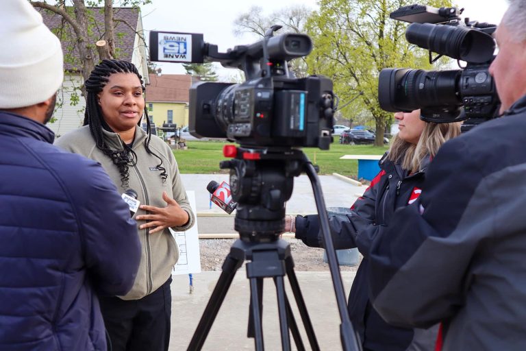 Myka speaking to news crew
