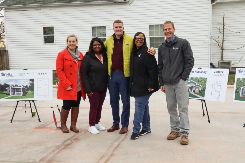 Habitat staff, board, Partner Family, and Sharon Tucker
