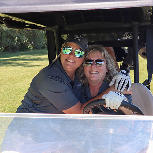 Crosby team in golf cart