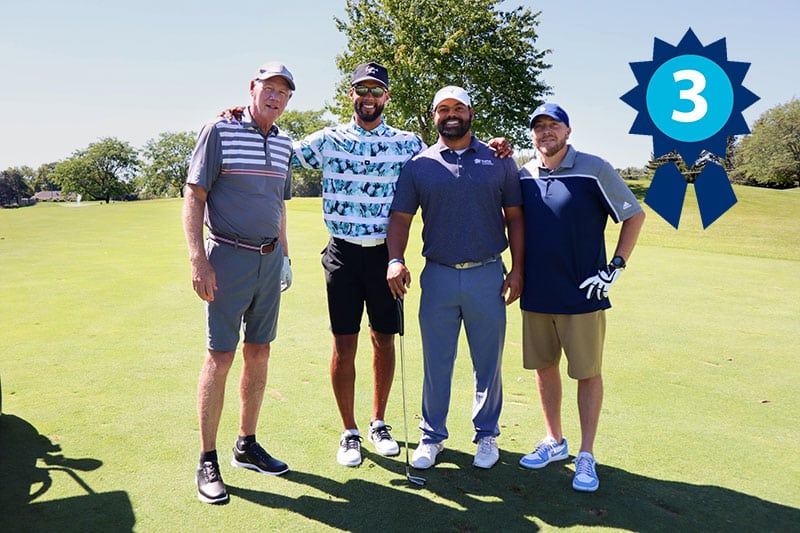 third place winners of golf outing posing for photo