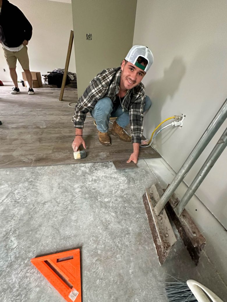 Male student installing floor