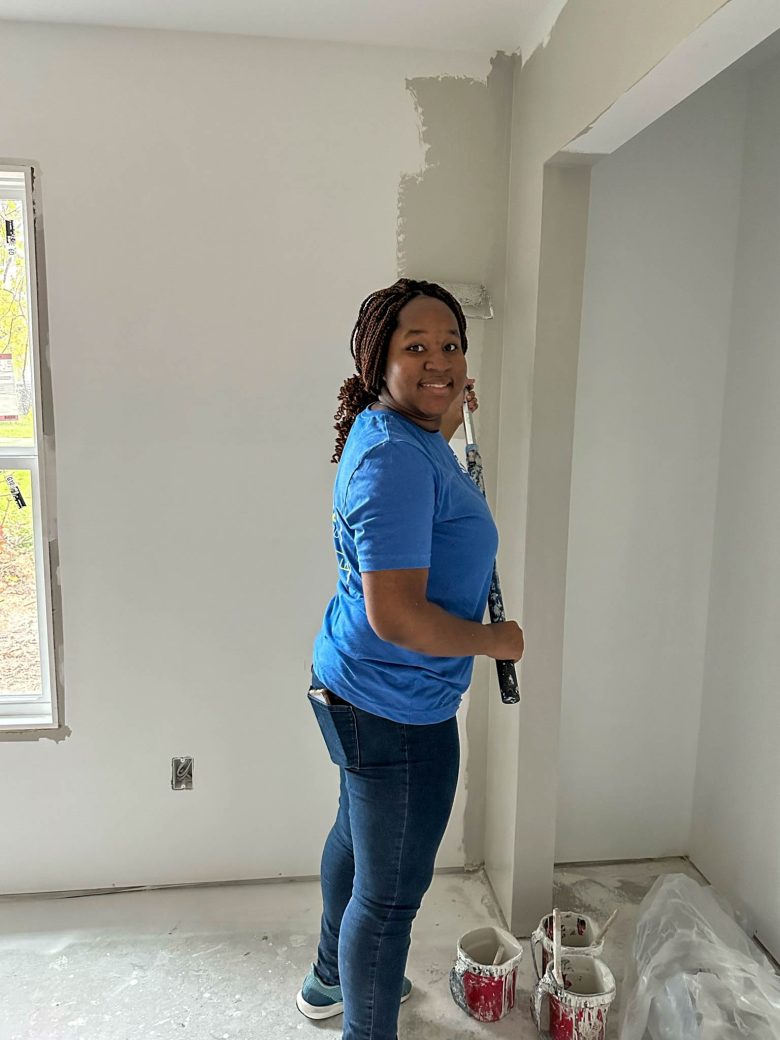 Female student with paint roller