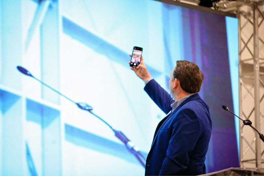 Habitat CEO taking selfie of crowd