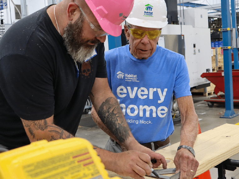 Man guiding volunteer