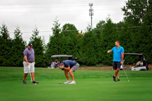 Golf player disappointed in his shot
