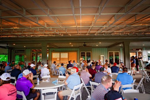 Golf teams sitting down for dinner