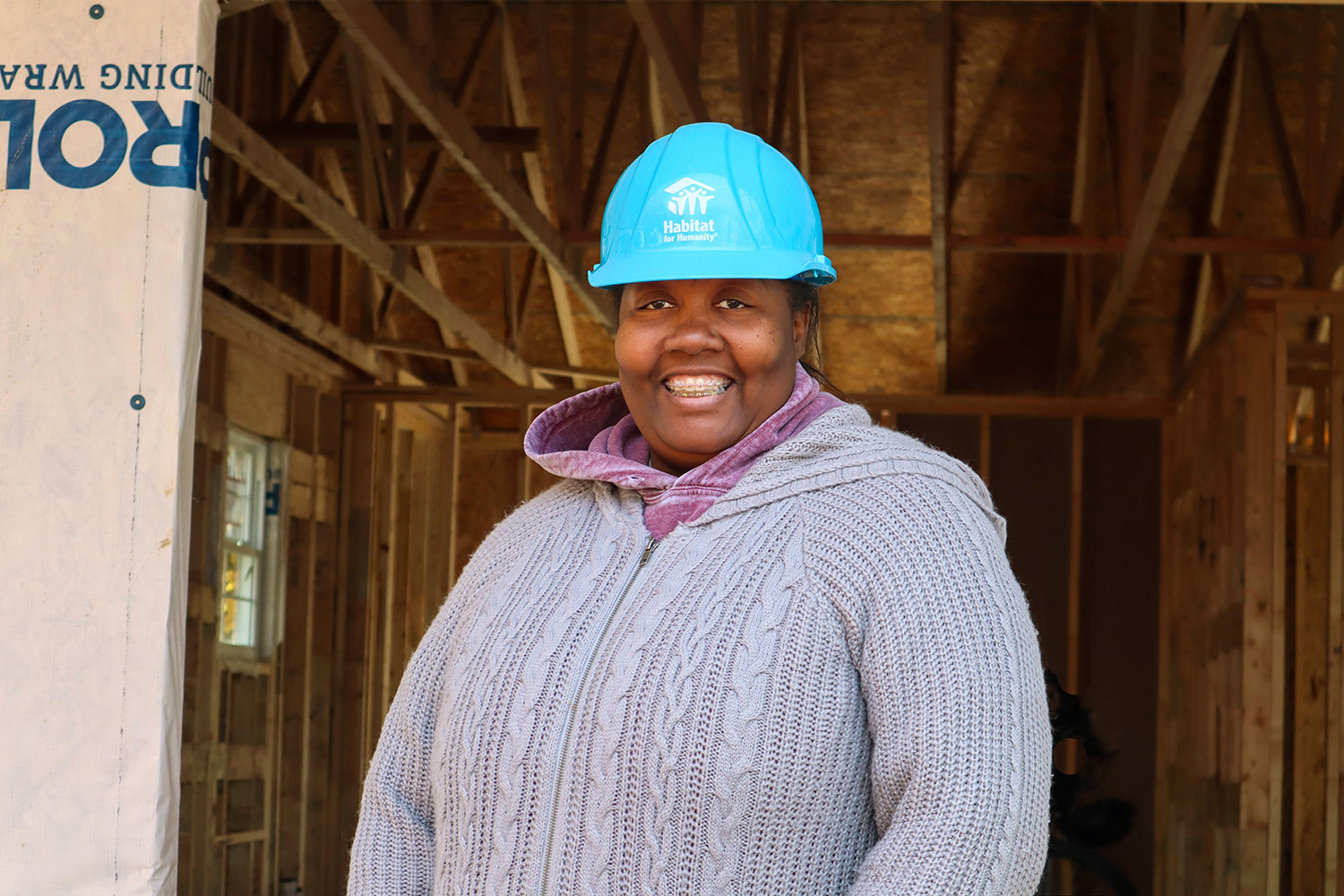 Jessica helping build her home