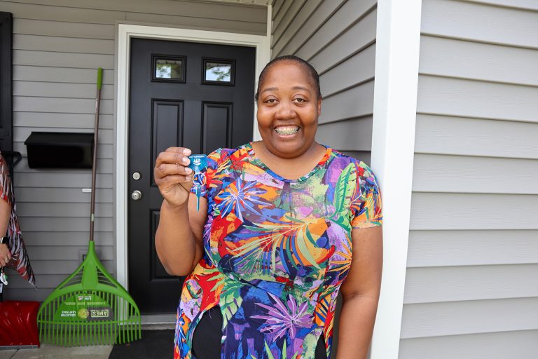 Jessice with her keys on the porch