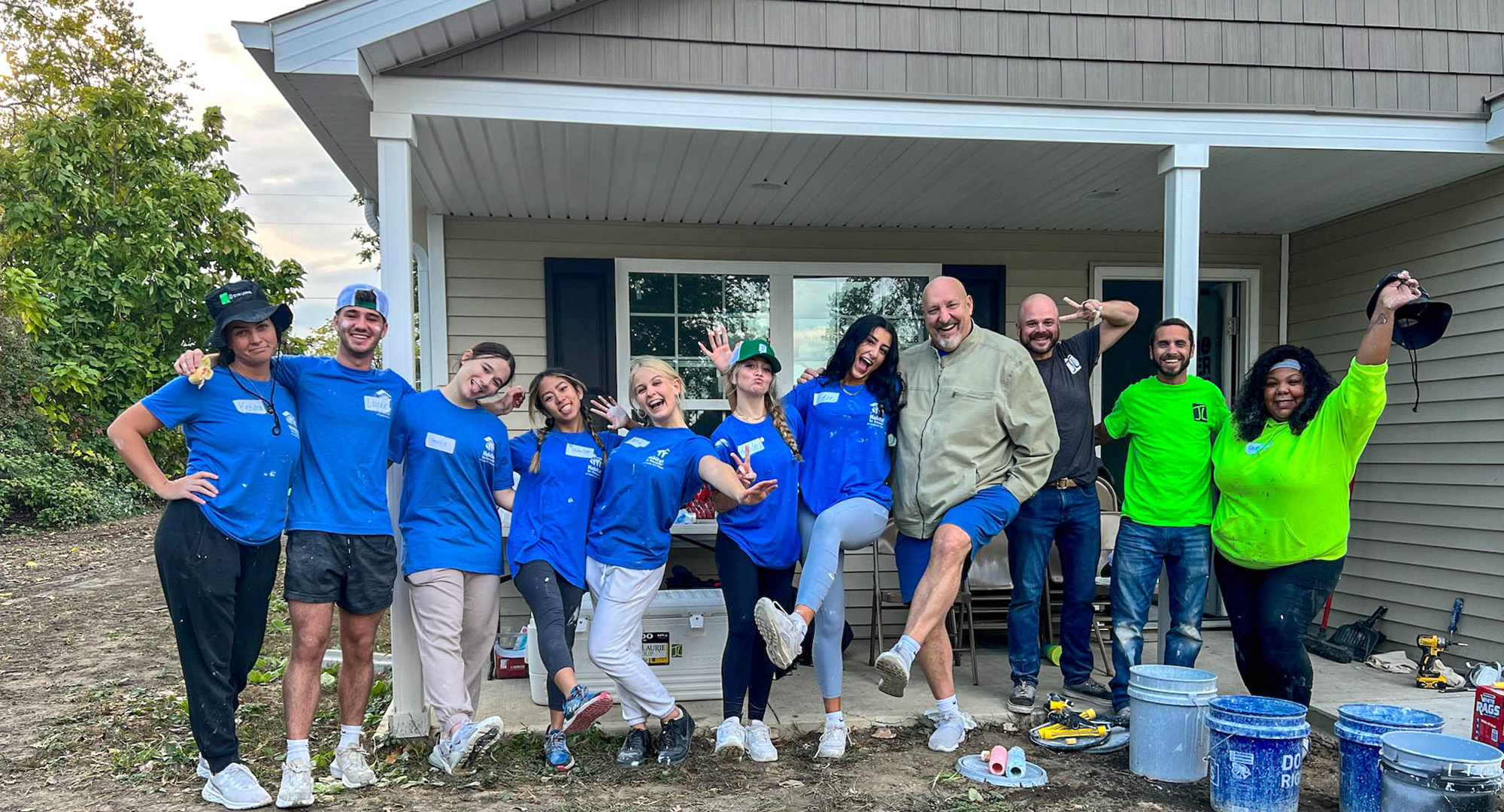 Group of volunteers in front of Habitat house