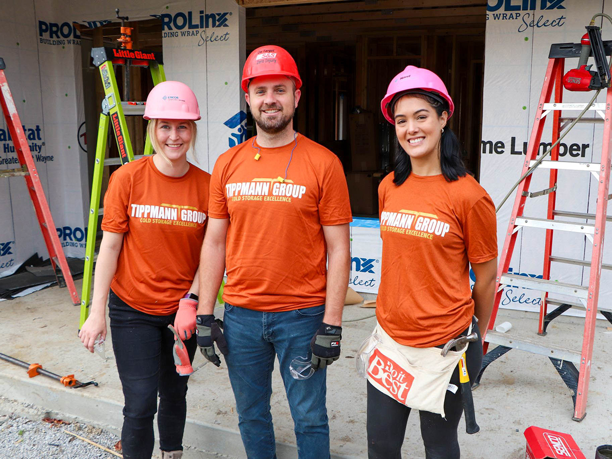 Three build site volunteers