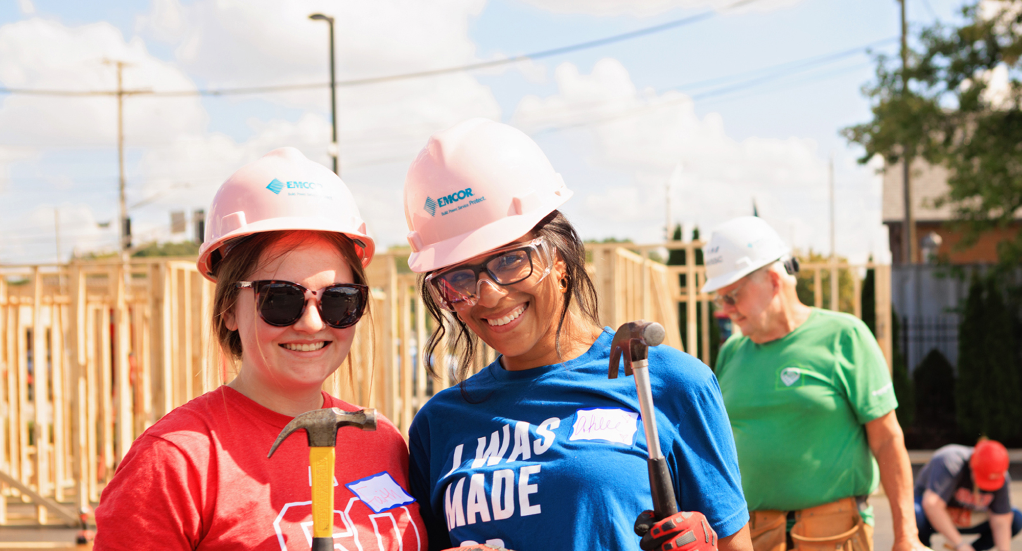 Female Volunteers with Hammers