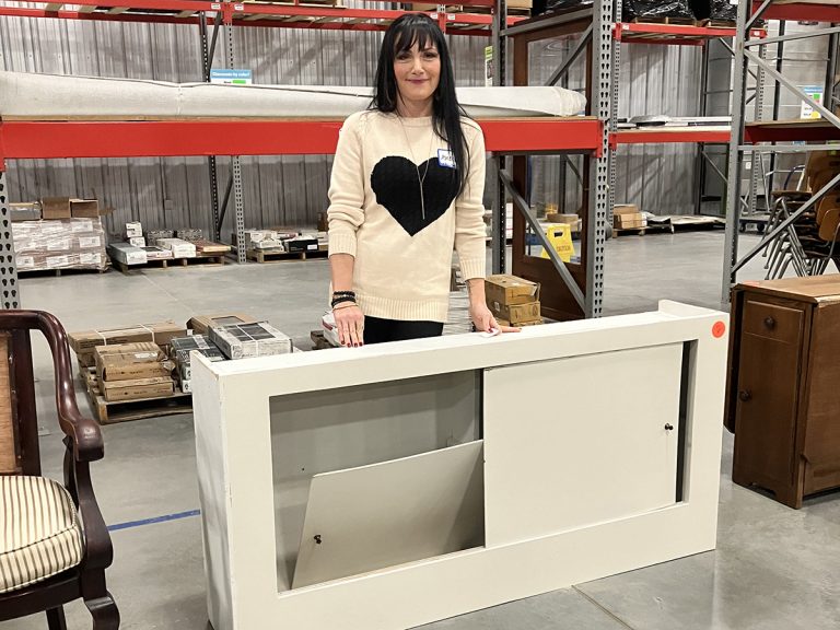 Audrey Harber with furniture to rehab