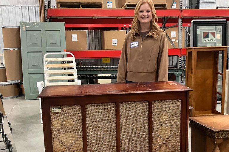 Hailee Gepfert with old record cabinet